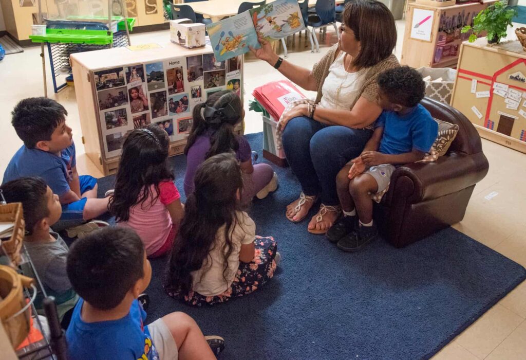 an educator reads to toddlers in a Pre-K 4 SA classroom