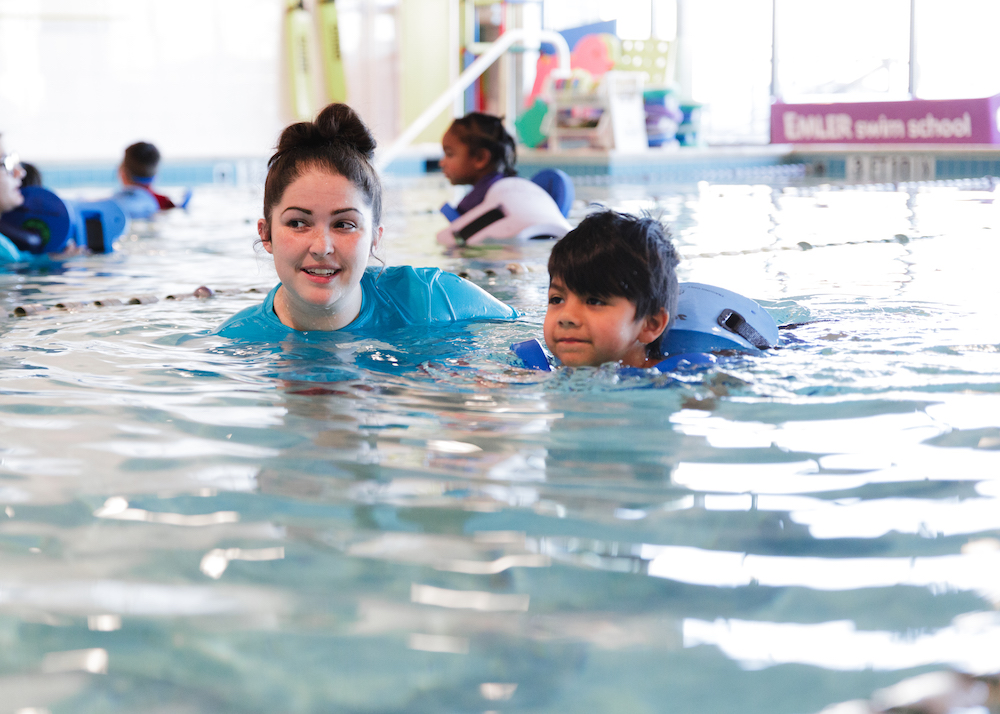 Young child learns how to swim