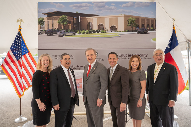 San Antonio leaders stand in front of a rendering of the new Educare center on the Southside of San Antonio.
