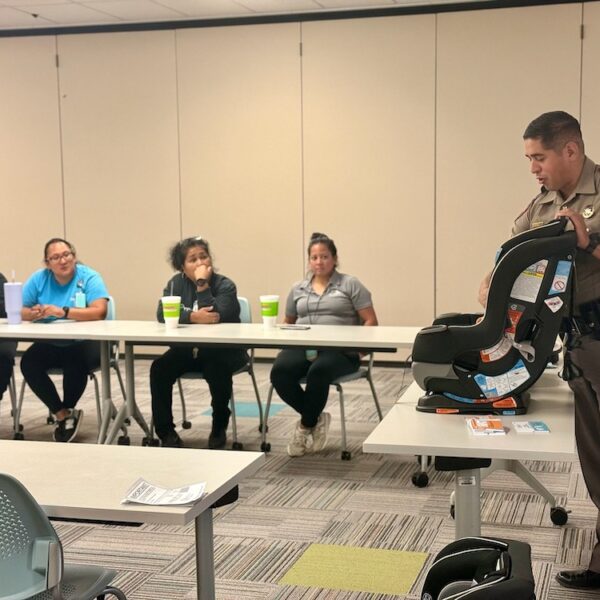 Car Safety Presentation A police officer is giving a presentation to a group of people