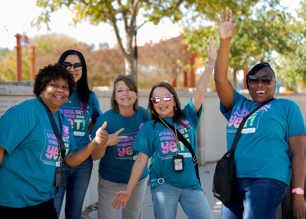 family reunion educators pose joyously for a photo