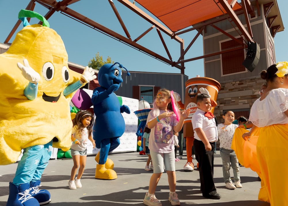 rockstar at family reunion mascots dance outside at the 7th Annual Pre-K 4 SA Family Reunion