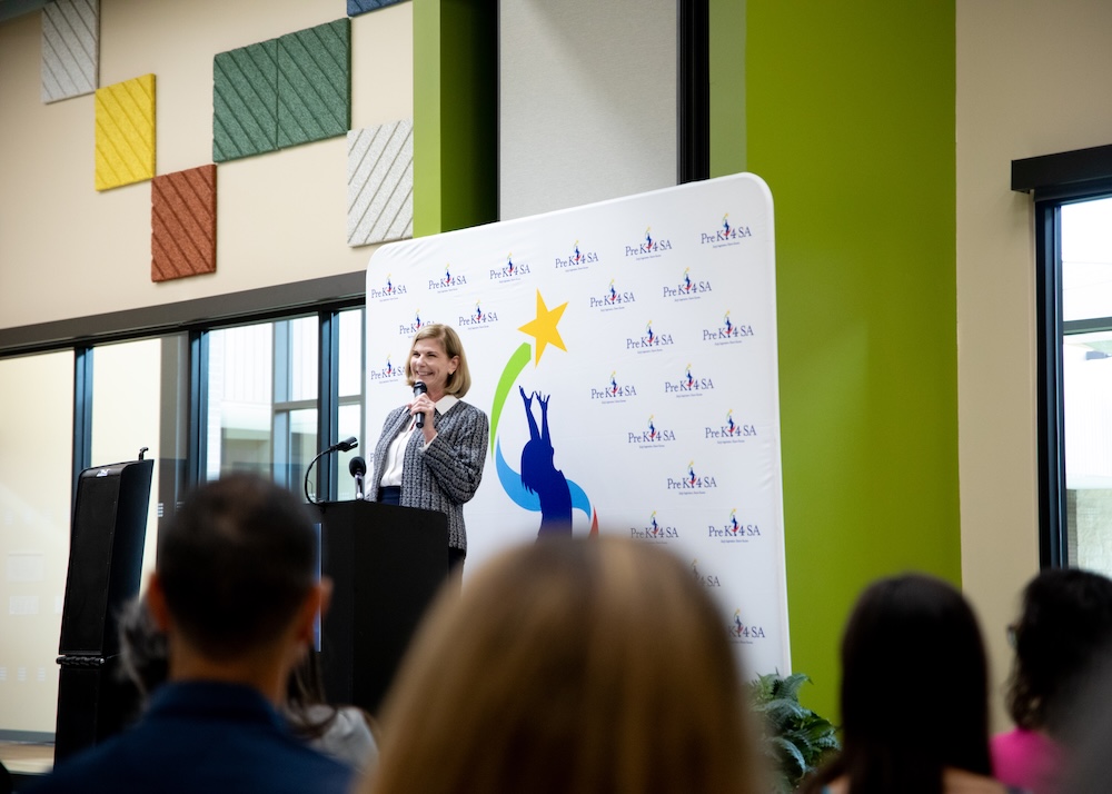 Dr. Sara Baray speaks at a podium