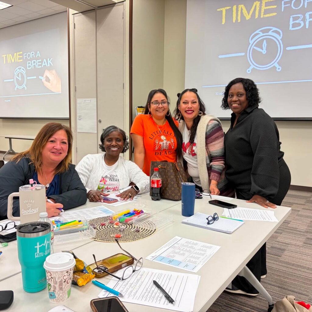 Analuisa Sandoval Preschool Teacher Madonna Center Educators gather at a table