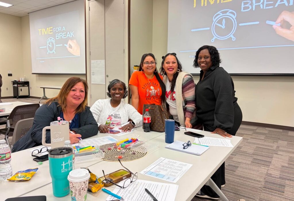 Educators gather at a table