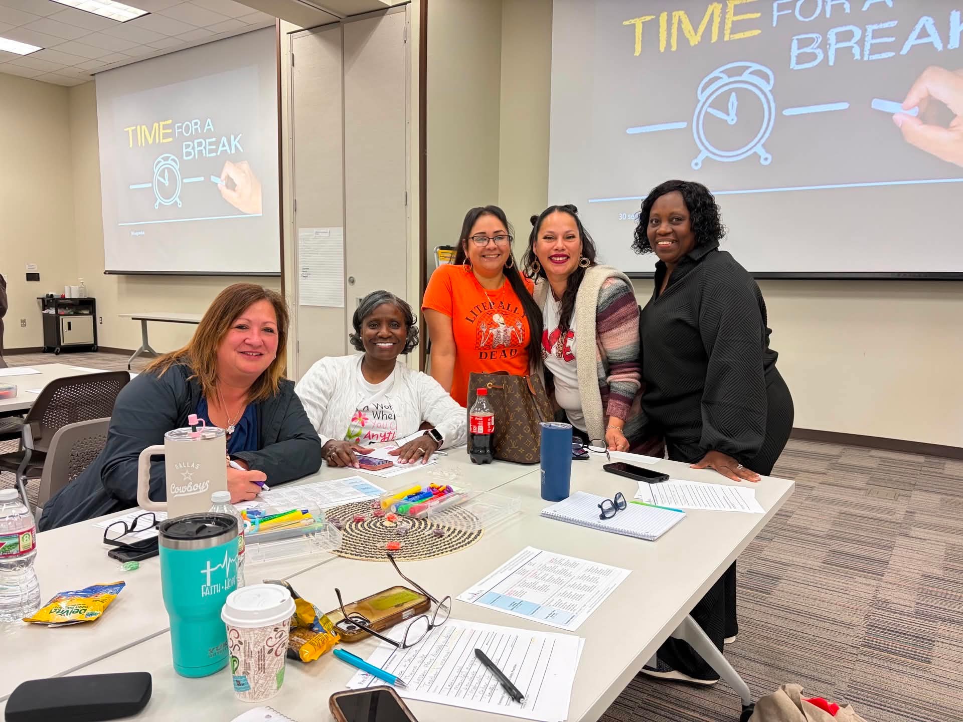 Educators gather at a table