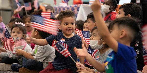 Children wave American flags