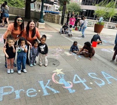 Educators and Children stand near Pre-K 4 SA Chalk Art