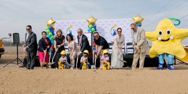 Pre-K 4 SA groundbreaking ceremony with children and officials at the event.