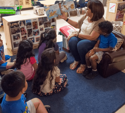 educator reads to students