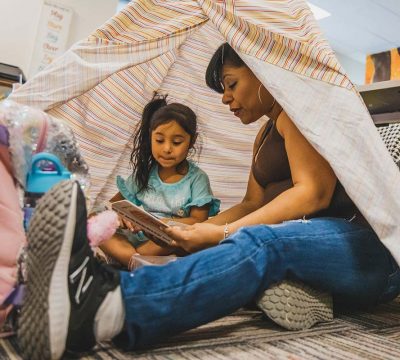 Mom reading to daughter