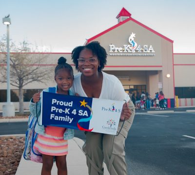 mother and child stand outside pre-k 4 sa