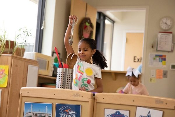 young girl in a classroom kitchen